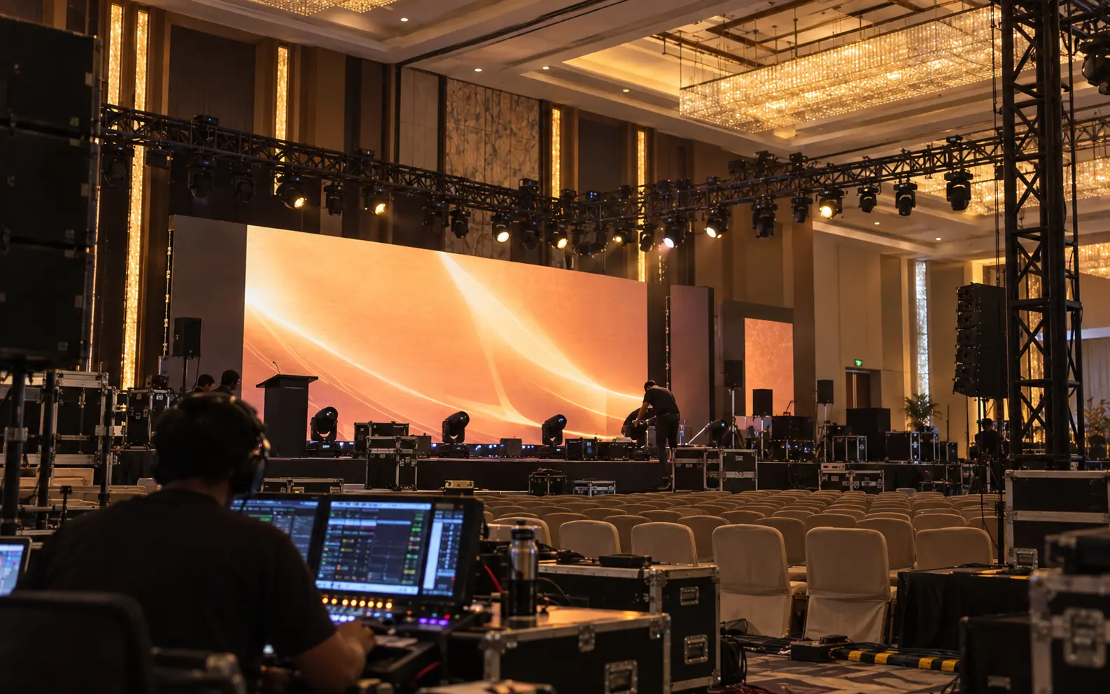 Auron production crew coordinating a stage and lighting setup before a corporate event
